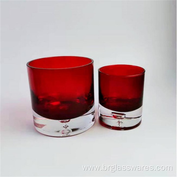 Thick base colored glass candle holder with water drop design